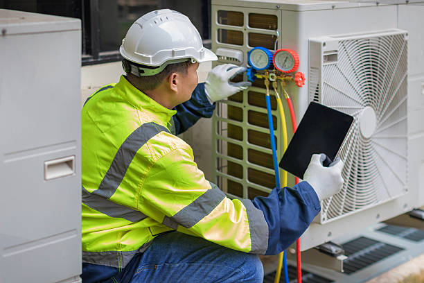 Professional Air Conditioning Repair technician working in Rainier, OR